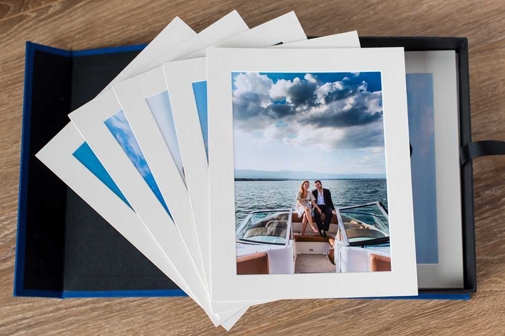 portfolio box of photos of couple on speedboat