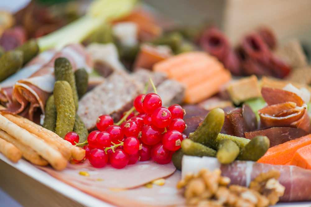 food platter service - carrot, berries, gherkins, cucumber, brightly coloured