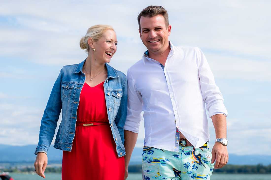 couple chatting and laughing as they walk towards the camera